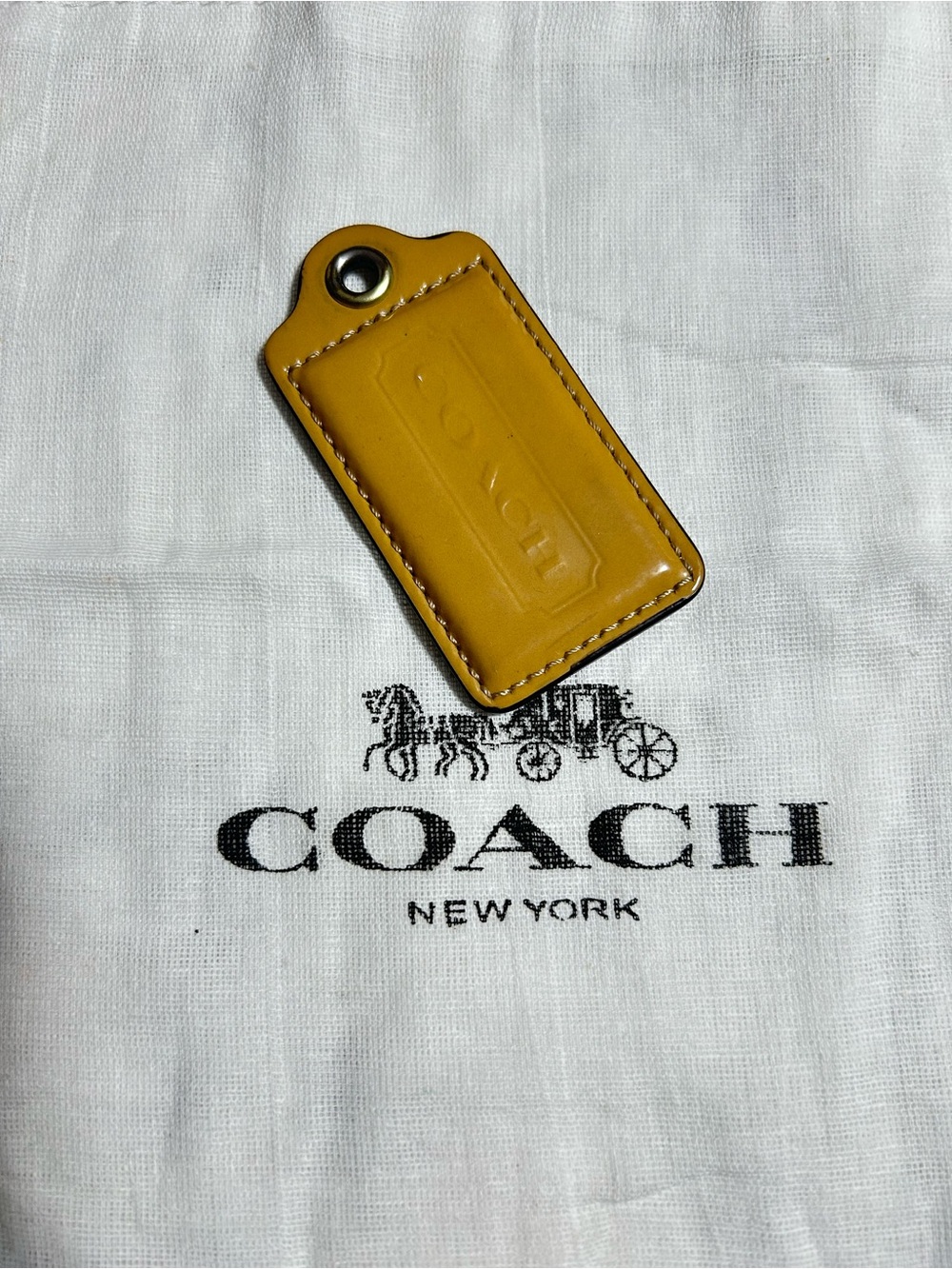 Coach Mustard Leather hang tag